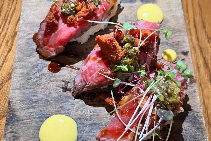 a plate of food on a wooden table